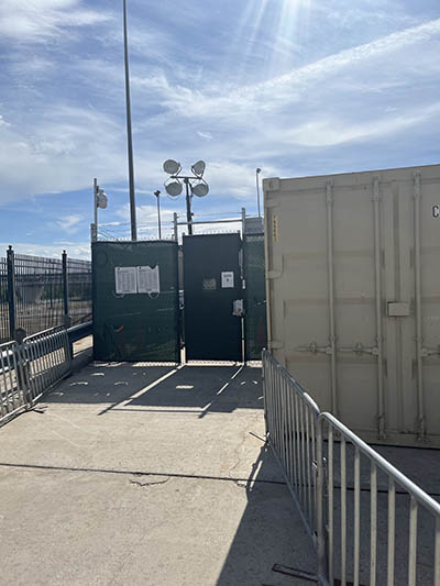 The gated entrance to the structures where MPP 2.0 hearings take place.