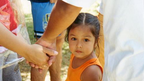 Child holding hands 